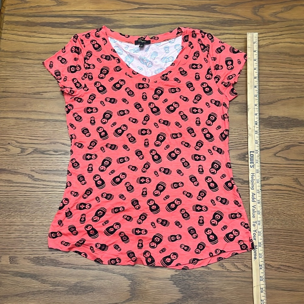Orange shirt with Nesting Doll Print